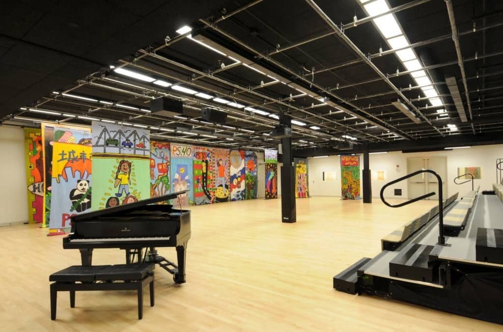 Large Performance Space with a stage and a piano
