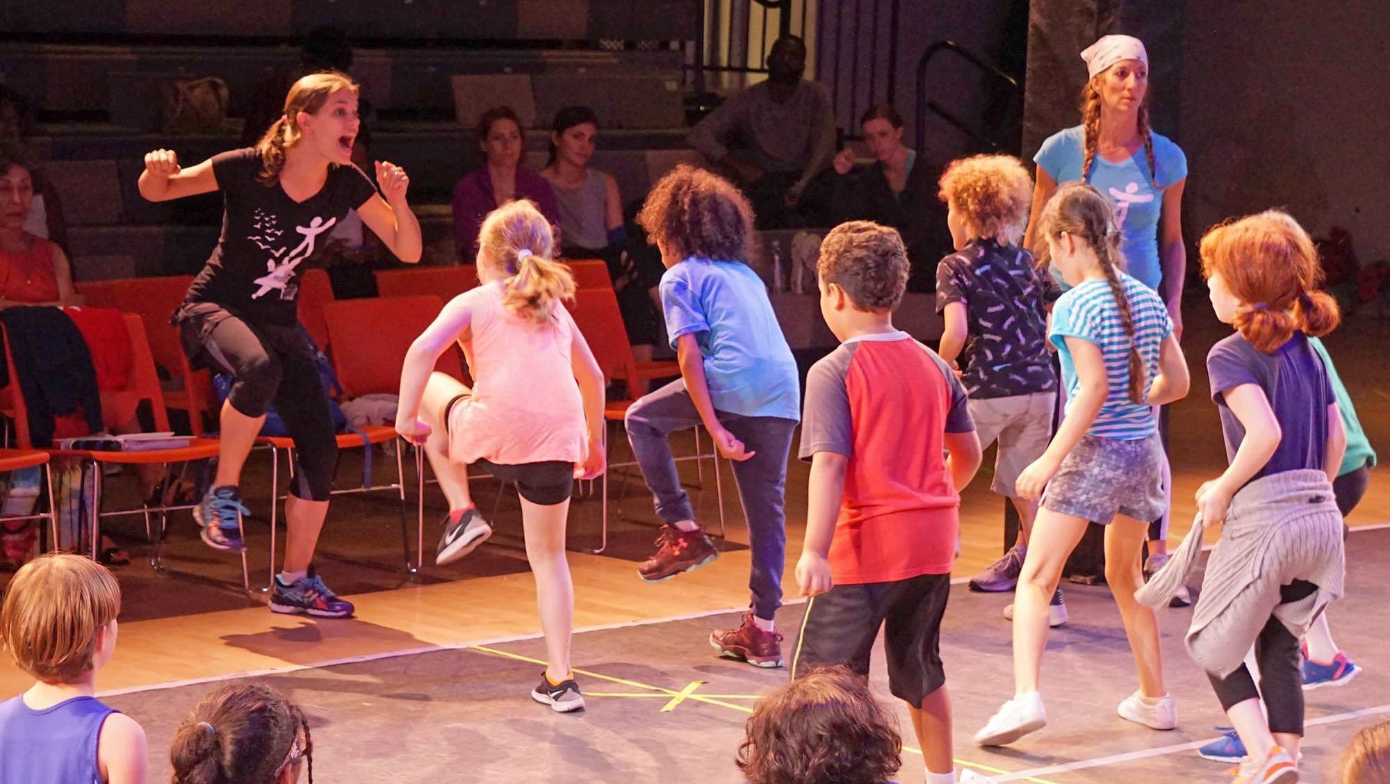 Boy with his arms raised up