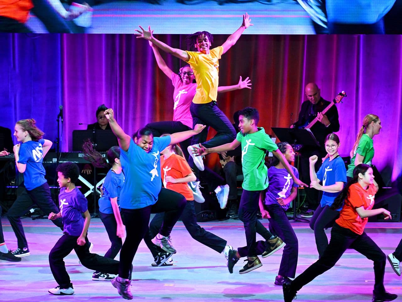 NDI Children leaping on stage