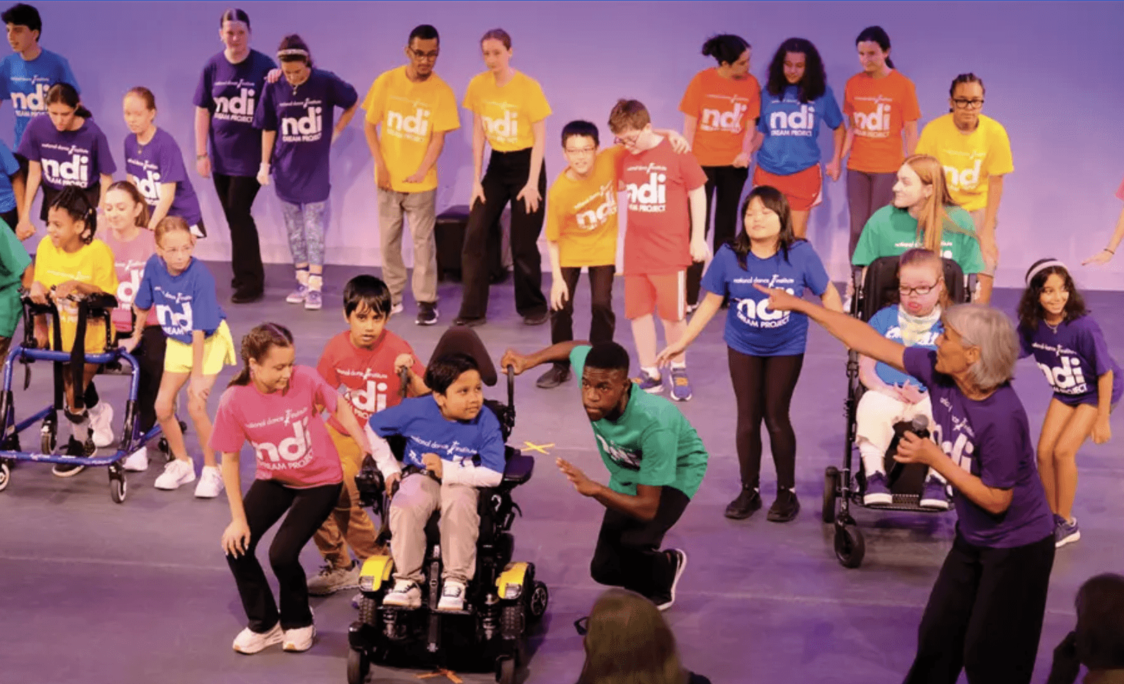 NDI Artistic Director and Co-Founder of the NDI DREAM Project directs children in rehearsals at NDI.