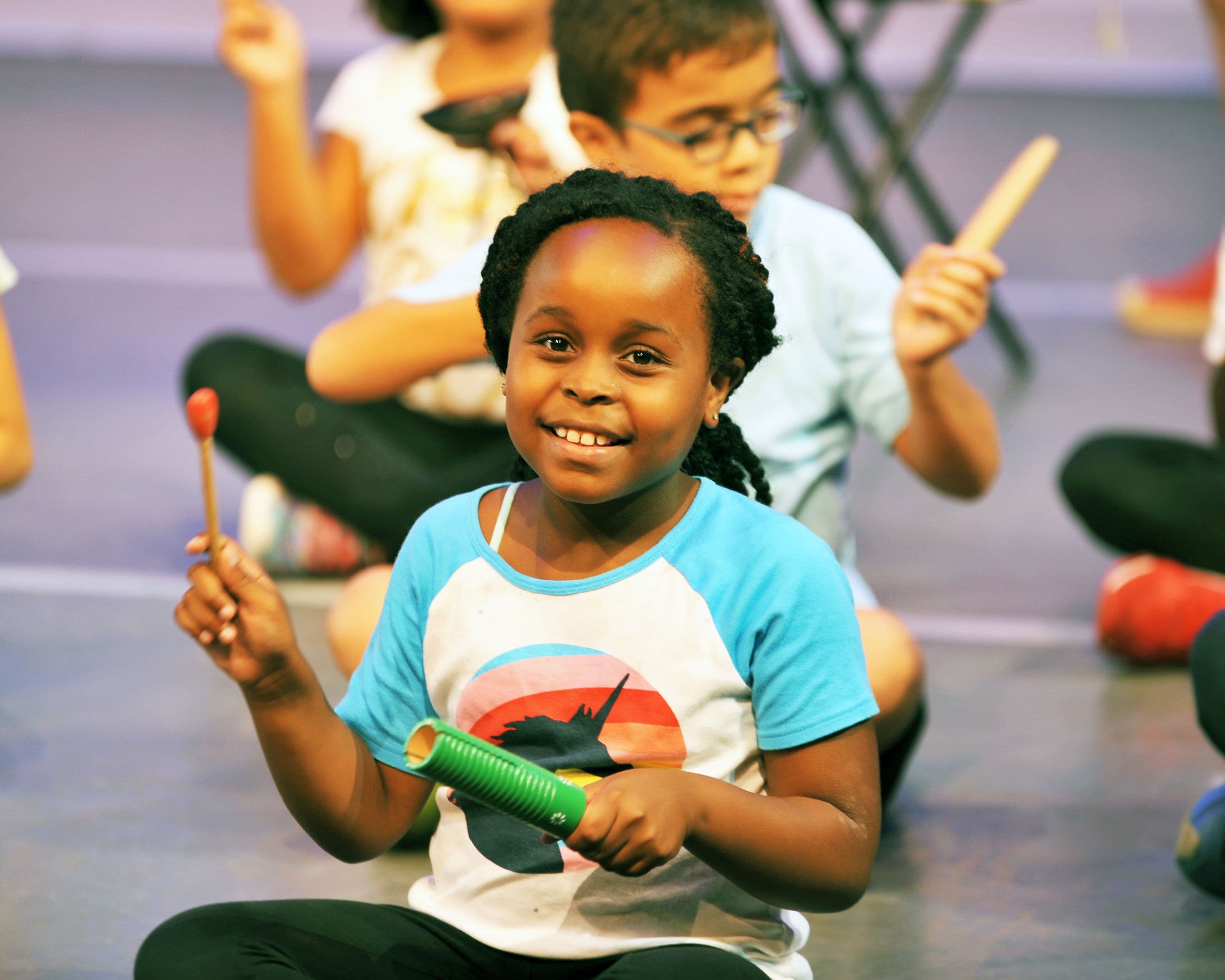 Girl in music class at NDI