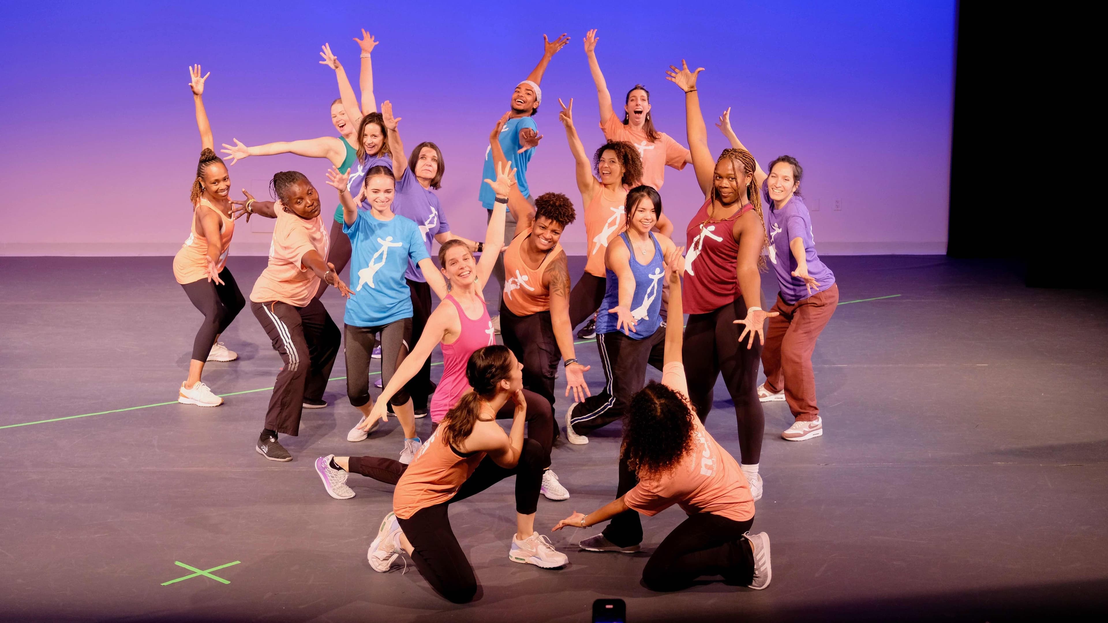 Group of students on stage posing
